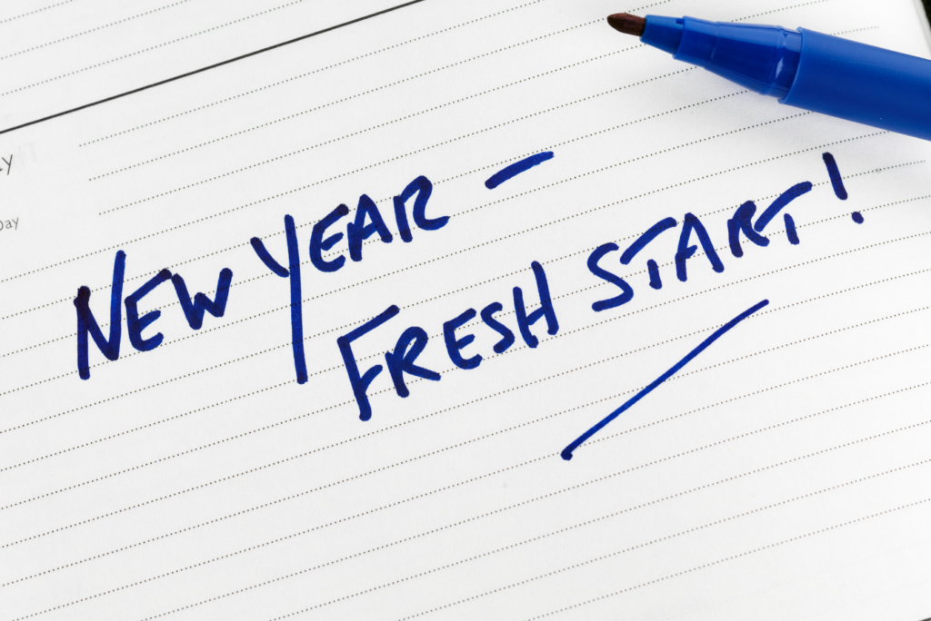 New Year Fresh Start is written on a paper