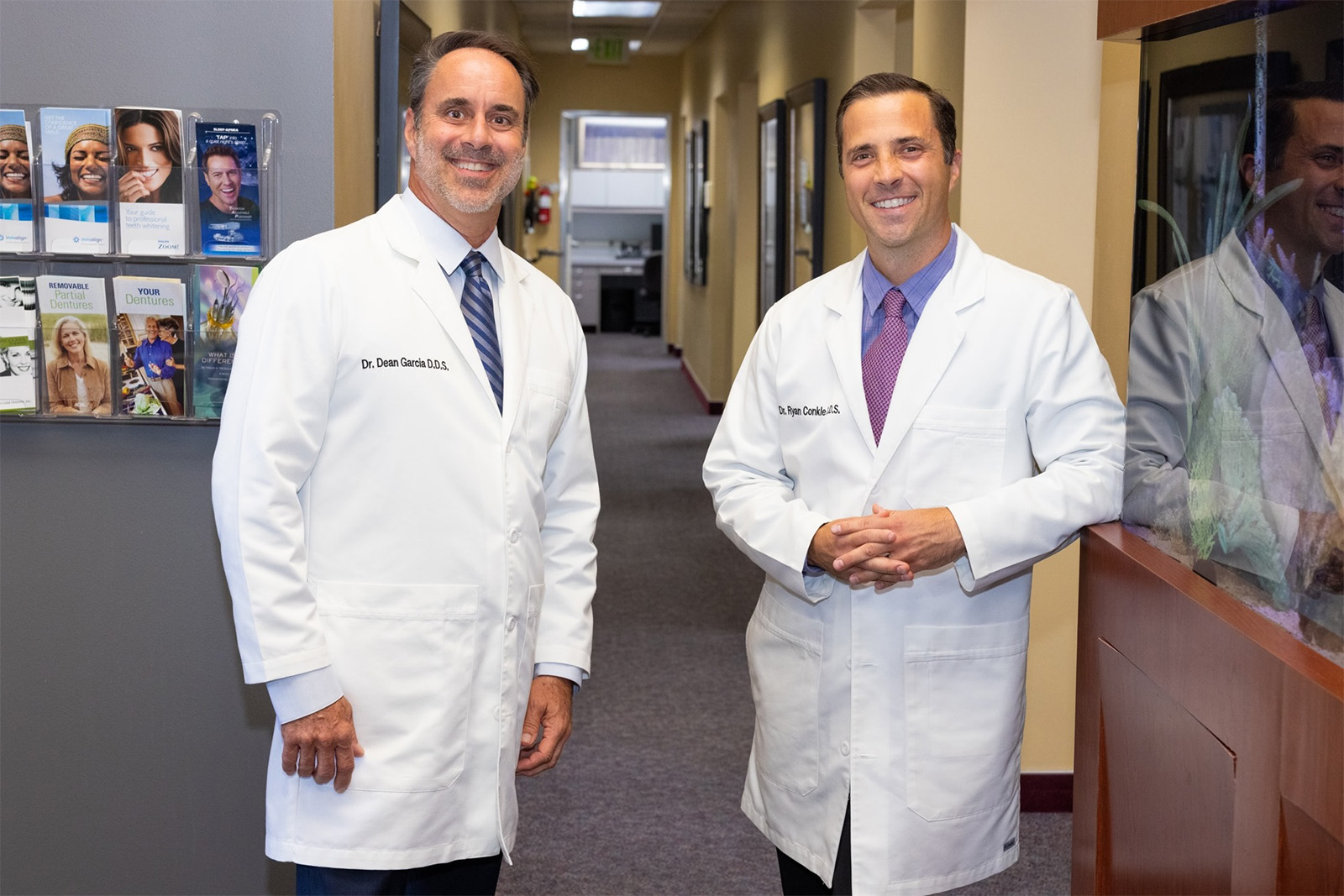 Dr. Conkle and Dr. Garcia in white coats